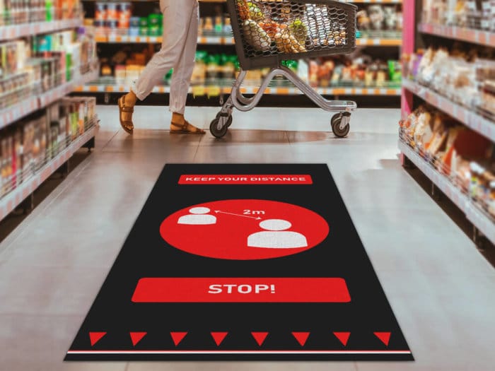 Social Distancing Floor Mat In Supermarket