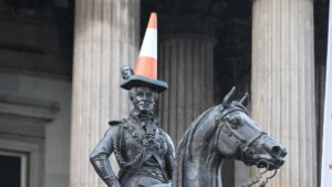 Traffic cone on a statue